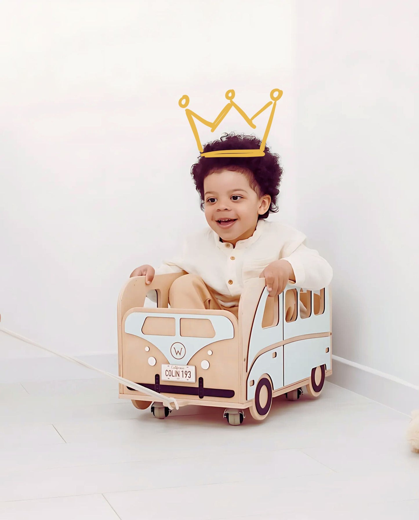 Personalized blue wagon used by child for developmental play