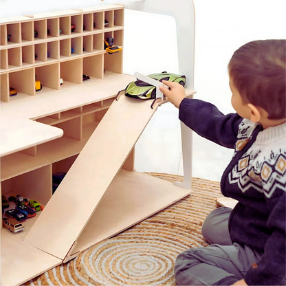 Child playing with Montessori ramp-style wooden toy car garage – great for 2-6 year olds
